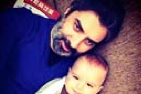 صورة- بطل "وادي الذئاب" ينشر صورة ابنه لأول مرة‎