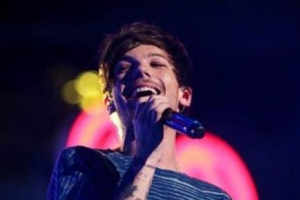 عضو فريق One Direction لويس توملينسون ينشر أول صورة لمولوده الجديد